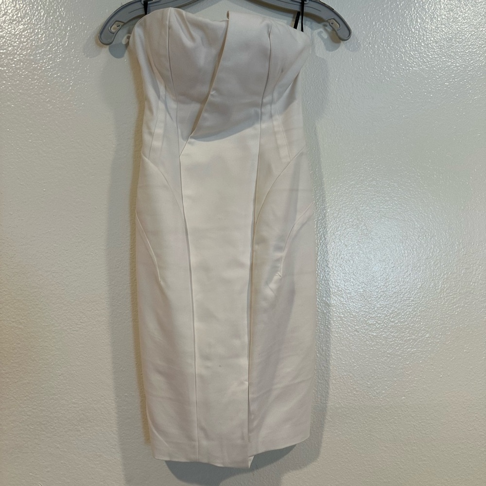 Bebe white strapless evening dress with zipper at the back all the way down.